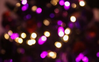Blurred Christmas lights in purple and white